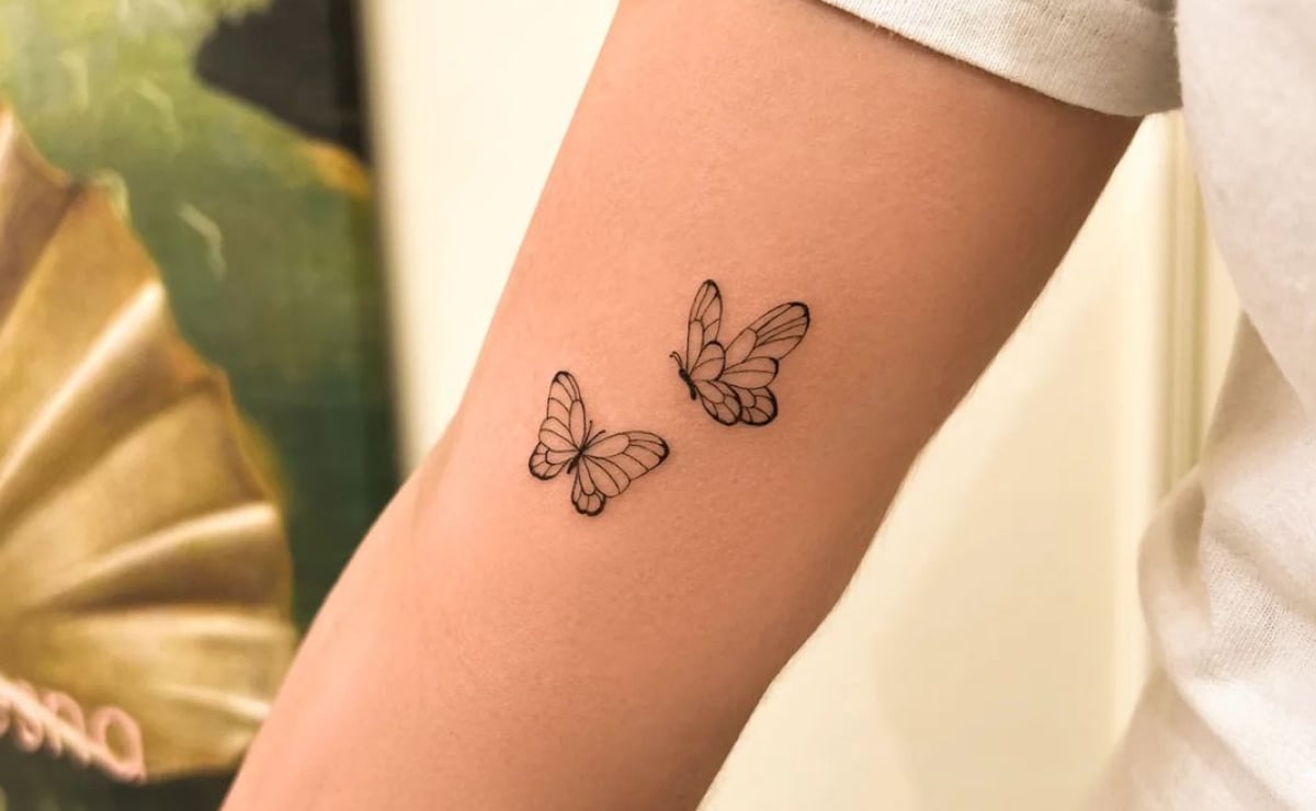 tatuagem borboleta realista delicada