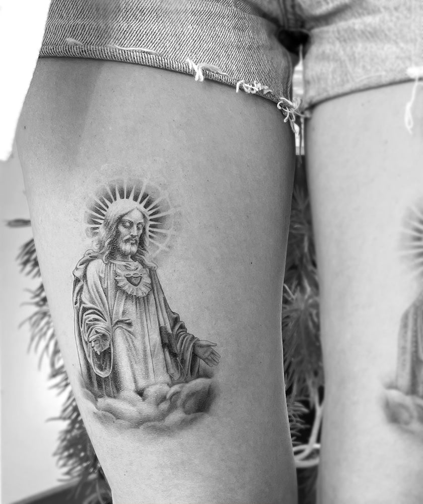 tatuagem de Jesus no braço